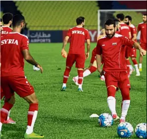  ??  ?? Hard at it: The Syrian football team training at Hang Jebat Stadium in Melaka.