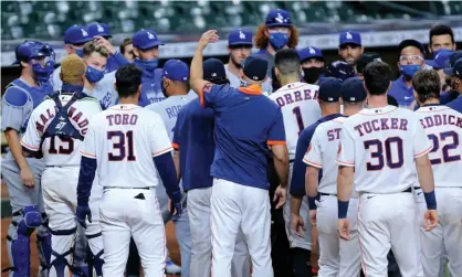  ??  ?? The Astros and Dodgers benches converge after growing tensions on Tuesday night. Photograph: Erik Williams/USA Today Sports
