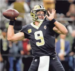  ?? DERICK E. HINGLE/USA TODAY SPORTS ?? Saints quarterbac­k Drew Brees warms up before a game against the Falcons on Nov. 10 in New Orleans.