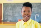  ??  ?? Seventeen-year-old Mbali Tshangna, preparing for a grade 10 maths test, speaks to her choir mates overseas ‘every day’ — sharing their joy.