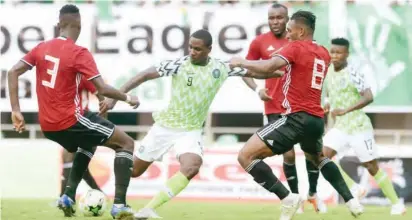  ??  ?? Super Eagles’ striker Odion Ighalo (9) is surrounded by Libyan players during the 2019 Africa Cup of Nations qualifier