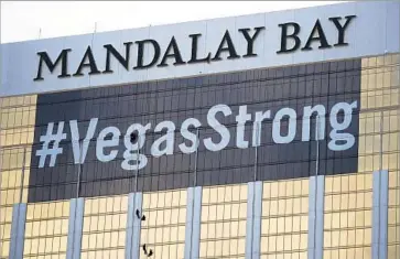  ?? John Locher Associated Press ?? THE HOTEL from which Stephen Paddock carried out his rampage has a message for tourists and residents.
