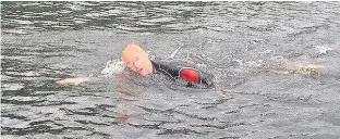  ??  ?? Huw Morgans, above and left, training on Lake Windermere for July’s channel swim