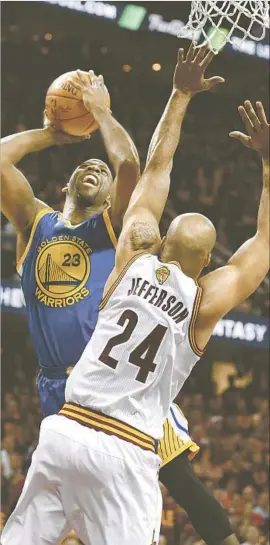  ?? Tony Dejak Associated Press ?? DRAYMOND GREEN goes up for a shot over Richard Jefferson. Green had only nine points but led the Warriors with 12 rebounds and three blocked shots.