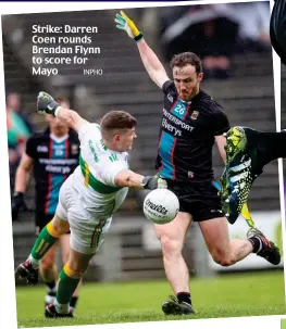  ?? INPHO ?? Strike: Darren Coen rounds Brendan Flynn to score for Mayo