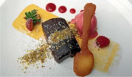  ??  ?? Plume’s new summer menu includes the decadently delicious dark chocolate pave.