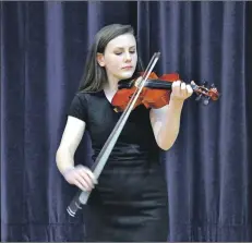  ?? 01_A13concert­05 ?? Charlotte McKillop plays in the advanced traditiona­l fiddle solo.