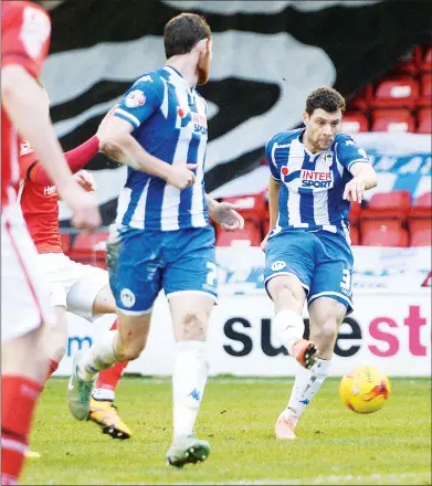  ??  ?? YANIC MAGIC: Wigan’s Yanic Wildschut scores their late winner