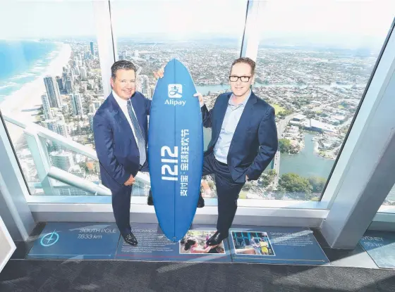  ?? Picture: GLENN HAMPSON ?? BPS Technology CEO Iain Dunstan and George Lawson from Alipay launch Alipay, which allows Chinese visitors to pay via their smartphone­s.