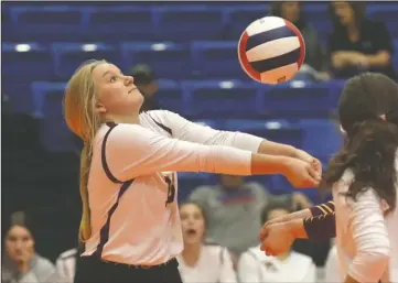  ?? The Sentinel-Record/Richard Rasmussen ?? SETTING IT UP: Lake Hamilton senior setter Kennedy Campbell bumps the ball for a teammate during Wednesday’s Class 5A quarterfin­al game against Greenwood at Bank OZK Arena. The Lady Bulldogs won, 3-0, to advance to today’s semifinal round.