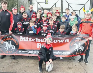  ?? (Pic: Sean Burke) ?? Members of Mitchelsto­wn Rugby Club on the ball at the St Patrick’s Day parade in Mitchelsto­wn, ready to leave from the gathering point at the old Mart.