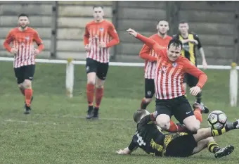  ??  ?? Silksworth CW (red/white) scrap for their win over Hebburn Reserves a fortnight ago. Pic by Kevin Brady.