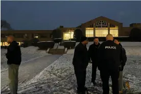  ?? ?? Police gather outside Temple Israel on 7 December 2023 in Albany, New York. Photograph: Maysoon Khan/AP