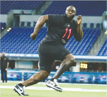  ?? Brian Spurlock / USA TODAY Sports Files ?? Defensive lineman Neville Gallimore, here going through a workout drill during the 2020 NFL Combine, has been getting an increasing­ly big workload for the Cowboys.