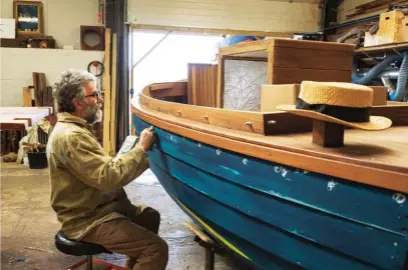  ??  ?? Below: Colin teaches students how to make ash paddles; an electric motor canoe is polished and finished