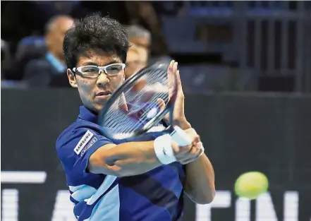  ?? — AP ?? At the top: Chung Hyeon of South Korea returning the ball to Andrey Rublev of Russia during the ATP Next Gen Finals on Wednesday.