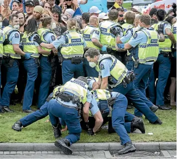  ?? ?? Anti-mandate protesters are evicted from Parliament by police on Thursday.