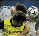  ?? JAV I E R S O R I A NO/A F P/G E T TY I M AG E S ?? Dortmund’s defender Mats Hummels, centre, vies with Real Madrid’s Pepe, left, and Sergio Ramos Wednesday in Madrid.
