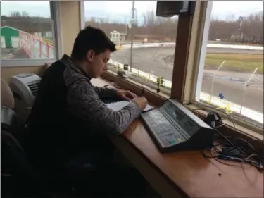  ?? ADAM DODD — THE NEWS-HERALD ?? Randy Maggio Jr. transition­s from the race track to the scorer’s tower as he learns the ropes at the Painesvill­e Speedway.