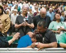  ?? JAE C. ?? Family members of one of the victims killed in Tuesday’s shooting at Robb Elementary School comfort each other during a prayer vigil in Uvalde, Texas, on Wednesday.