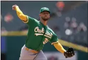  ?? PAUL SANCYA — THE ASSOCIATED PRESS ?? Oakland Athletics pitcher James Kaprielian throws against the Detroit Tigers in the first inning Thursday in Detroit.