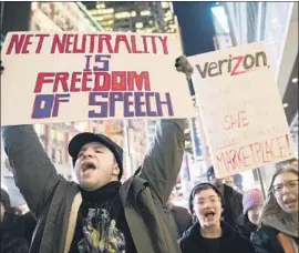  ?? Mary Altaffer Associated Press ?? THE FCC is set to vote this week to end net neutrality, which has ensured internet providers don’t give unequal treatment. Above, a rally in New York last week.