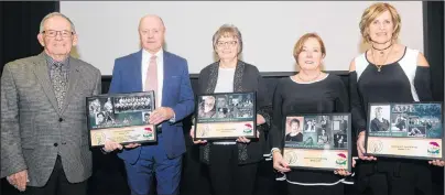  ?? JASON MALLOY/THE GUARDIAN ?? The P.E.I. Sports Hall of Fame held its 2017 induction ceremony Friday in Charlottet­own. From left are Jack Kane and Vince Mulligan from the 1964-65 St. Dunstan’s Saints hockey team, Sharon Dunn, wife of the late Ken (Trixie) Dunn, Debbie MacMurdo and...