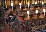  ?? JONATHAN BRADY — POOL VIA AP ?? Britain’s Queen Elizabeth II takes her seat during the funeral of Prince Philip, the man who had been by the Queen’s side for 73years, at Windsor Castle, Windsor, England, on Saturday.