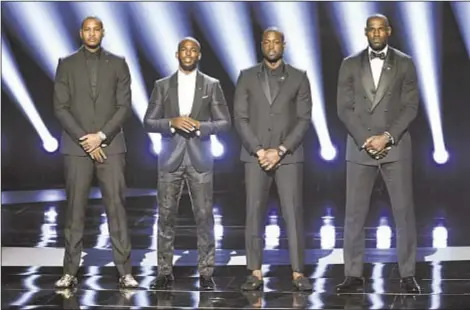  ??  ?? Shortly after Carmelo Anthony’s Instagram post following police shooting deaths of Alton Sterling and Philando Castile, Chris Paul, Dwyane Wade & LeBron James joined him on stage for statement at ESPYs, reminiscen­t of when stars such as Bill Russell,...