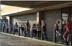  ?? RICHARD VOGEL — THE ASSOCIATED PRESS ?? People line up at a California Department of Motor Vehicles office prior to opening in 2018.