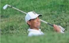  ?? Picture: SAM GREENWOOD/GETTY ?? ROUGH DAY: Tiger Woods of the United States hits his third shot on the 13th hole at Muirfield Village.