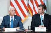 ?? ANDREW HARNIK/AP ?? Vice President Mike Pence, left, with Kansas Secretary of State Kris Kobach, speaks at a July commission meeting.