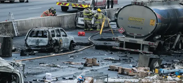  ?? CHRISTOPHE­R KATSAROV / THE CANADIAN PRESS ?? Emergency crews among the wreckage of a fatal crash north of Toronto that closed a stretch of highway in both directions south of Barrie, Ont.