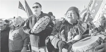  ??  ?? People celebrate in Oceti Sakowin camp as ‘water protectors’ continue to demonstrat­e against plans to pass the Dakota Access pipeline near the Standing Rock Indian Reservatio­n, near Cannon Ball, North Dakota, US. — Reuters photo