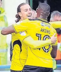  ??  ?? WHAT AN IRV Jackson Irvine is mobbed by Lucas Akins