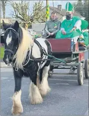  ?? ?? St Patrick being led into Castletown­roche on horse drawn carriage for Sunday’s parade.