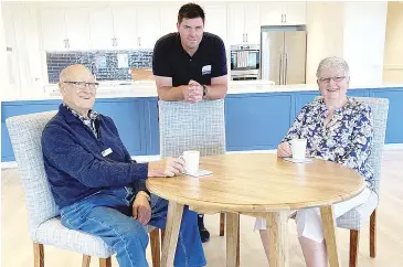  ??  ?? Live-in manager Leigh Brown, (centre) with residents Ted Turner and Marilyn Reid, who are embracing life at The Range Retirement Village.