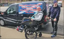  ??  ?? David MacPherson junior beams as he sits in the Joëlette wheelchair, pushed by JAPES founder Nelson Liddle.