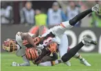  ?? KIRBY LEE, USA TODAY SPORTS ?? Redskins cornerback Josh Norman, left, tackles Bengals receiver A.J. Green during Sunday’s game in London.