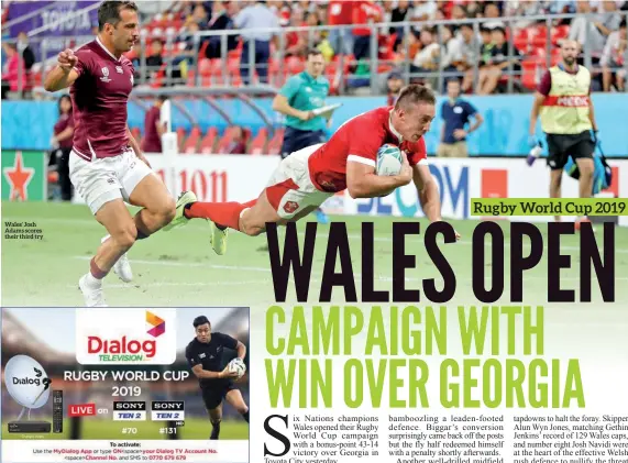  ??  ?? Wales’ Josh Adams scores their third try