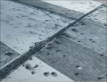  ?? THE ASSOCIATED PRESS ?? Craters left by shelling cover a field on the front line close to Bakhmut in the Donetsk region of Ukraine on Thursday.