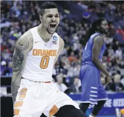  ?? CHARLIE RIEDEL / AP PHOTO ?? Syracuse’s Michael Gbinije celebrates after making a basket during the first half of a second-round
game against Middle Tennessee on Sunday.