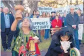  ?? EDDIE MOORE/JOURNAL ?? Concha Garcia, left, from Oaxaca, Mexico, and Jolen Eustace, from Zuni Pueblo, bless a rally in support of sanctuary cities outside City Hall in Santa Fe on Dec. 14.