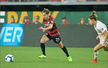  ?? Craig Mitchelldy­er/Portland Thorns ?? Meghan Klingenber­g races toward the ball during a game between her Portland Thorns and the Houston Dash at Providence Park on Sept. 21 in Portland.