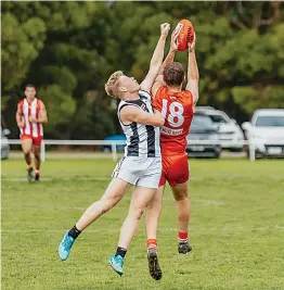  ?? ?? Poowong’s Jake Cochrane attempts to spoil Trafalgar’s Darcy Brock.