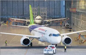  ??  ?? Workers move a C919, China’s first homegrown large passenger aircraft, out of a hangar at the Shanghai base of Commercial Aircraft Corp of China on Nov 8.