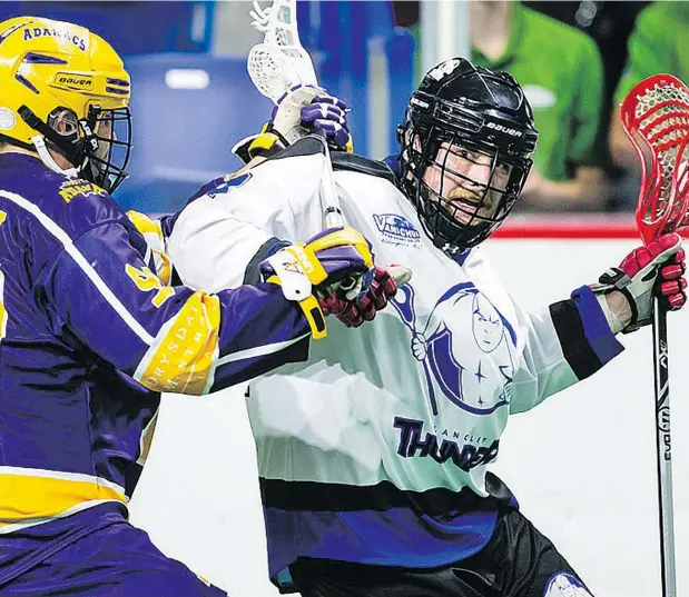  ??  ?? Dane Dobbie of the Langley Thunder, right, scored four goals on Wednesday night and has been a great addition for the Western Lacrosse Associatio­n squad, which beat the Coquitlam Adanacs 8-7 thanks to an offensive explosion in the third period.