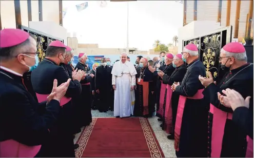  ?? Vatican Media / AFP via Getty Images ?? A handout picture released by the Vatican media office on Saturday shows Pope Francis arriving for a Mass at Baghdad's Saint Joseph Cathedral on the second day of the first papal visit to Iraq.