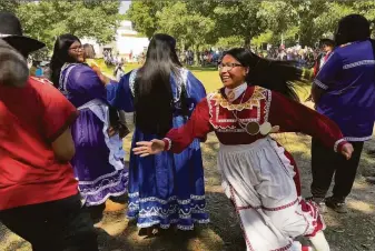  ?? Michael Warren / Associated Press ?? Isley Phillips, 18, joins the traditiona­l “Raccoon Dance.” The Choctaw teen participat­ed in the 30th annual Ocmulgee Indigenous Celebratio­n at the Ocmulgee Mounds in Macon, Ga.