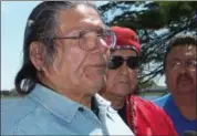  ?? JEFF BAENEN — THE ASSOCIATED PRESS FILE ?? American Indian activist Dennis Banks, left, speaks to reporters on Lake Bemidji, during an American Indian treaty rights protest in Bemidji, Minn. The family of Banks says he died Sunday at the age of 80. Banks was a co-founder of the American Indian...